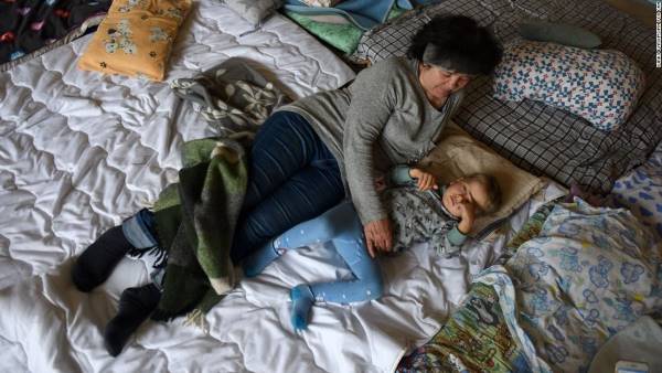 Valentyna, 58, with her grandson Andrii. She said she hopes that Russian mothers will hear about what their soldiers are doing to Ukrainian women.