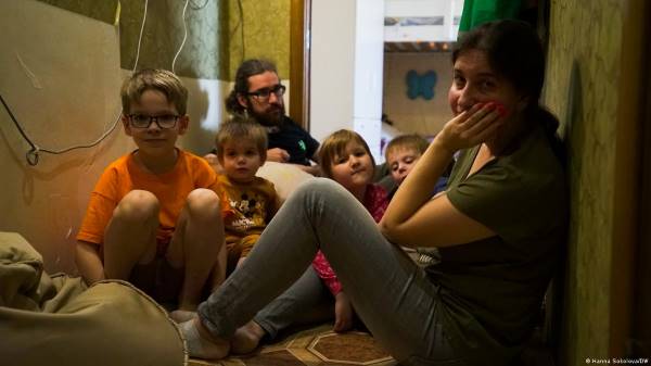 The Lvovuh family is waiting for the air alarm in the corridor of their own apartment