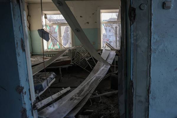 An overturned crib remains in one of the rooms of the maternity ward struck by a missile in Vilnyansk, Ukraine.